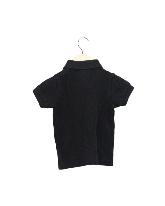 A Black Short Sleeve Polos from Lacoste in size 6-12M for boy. (Back View)