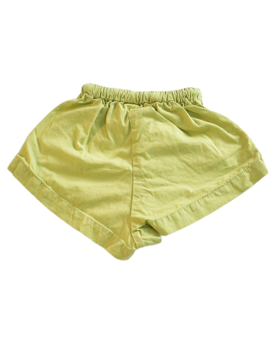 A Green Shorts from Millk in size 3-6M for girl. (Back View)