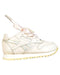 A White Sneakers from Reebok in size 12-18M for girl. (Front View)