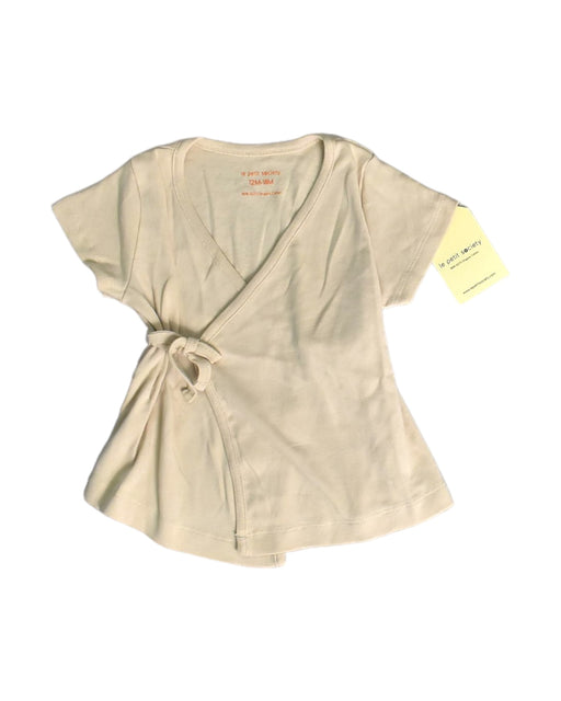 A Beige Short Sleeve Tops from Le Petit Society in size 12-18M for girl. (Front View)