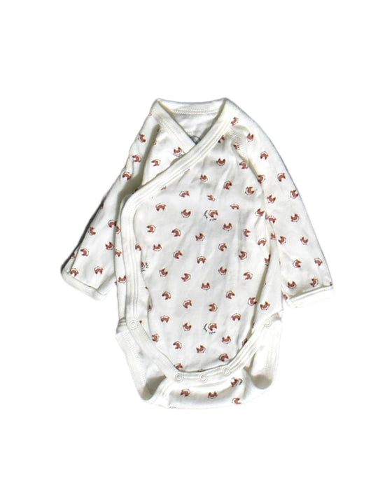 A White Long Sleeve Bodysuits from Petit Bateau in size Newborn for boy. (Front View)