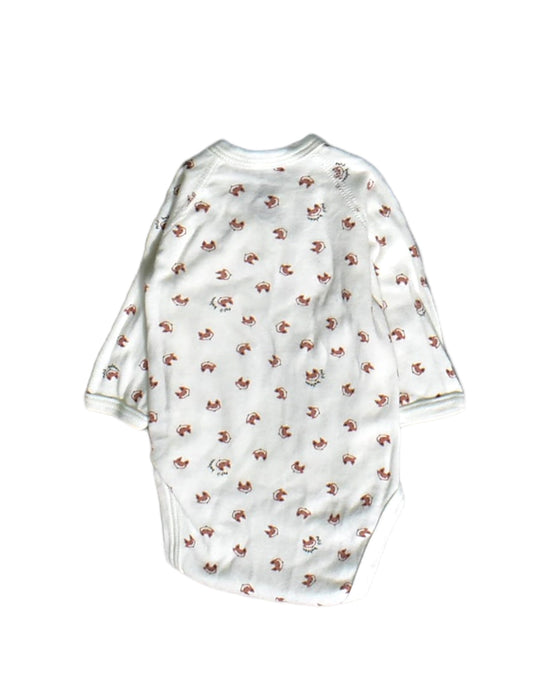 A White Long Sleeve Bodysuits from Petit Bateau in size Newborn for boy. (Back View)