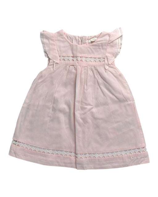 A Pink Sleeveless Dresses from Chloe in size 3-6M for girl. (Front View)