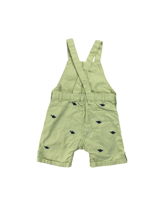 A Green Overall Shorts from Retykle in size 12-18M for neutral. (Back View)