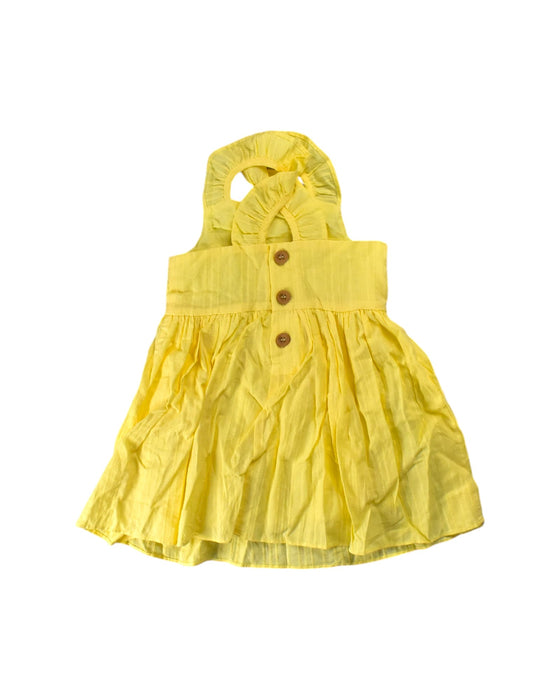 A Yellow Sleeveless Dresses from Our Mini Nature in size 2T for girl. (Back View)