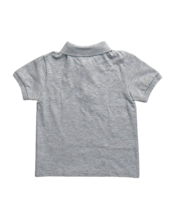 A Grey Short Sleeve Polos from Lacoste in size 5T for neutral. (Back View)