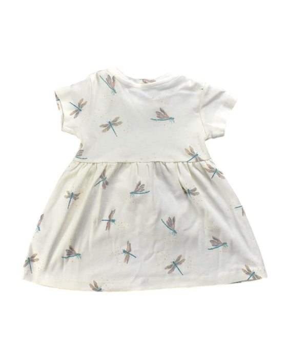 A White Short Sleeve Dresses from Le Petit Society in size 6-12M for girl. (Back View)